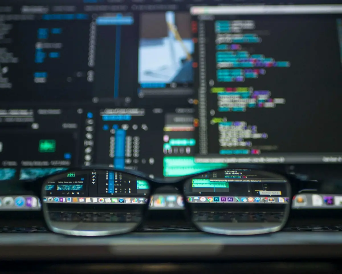 Developer workstation with application source code on multiple screens